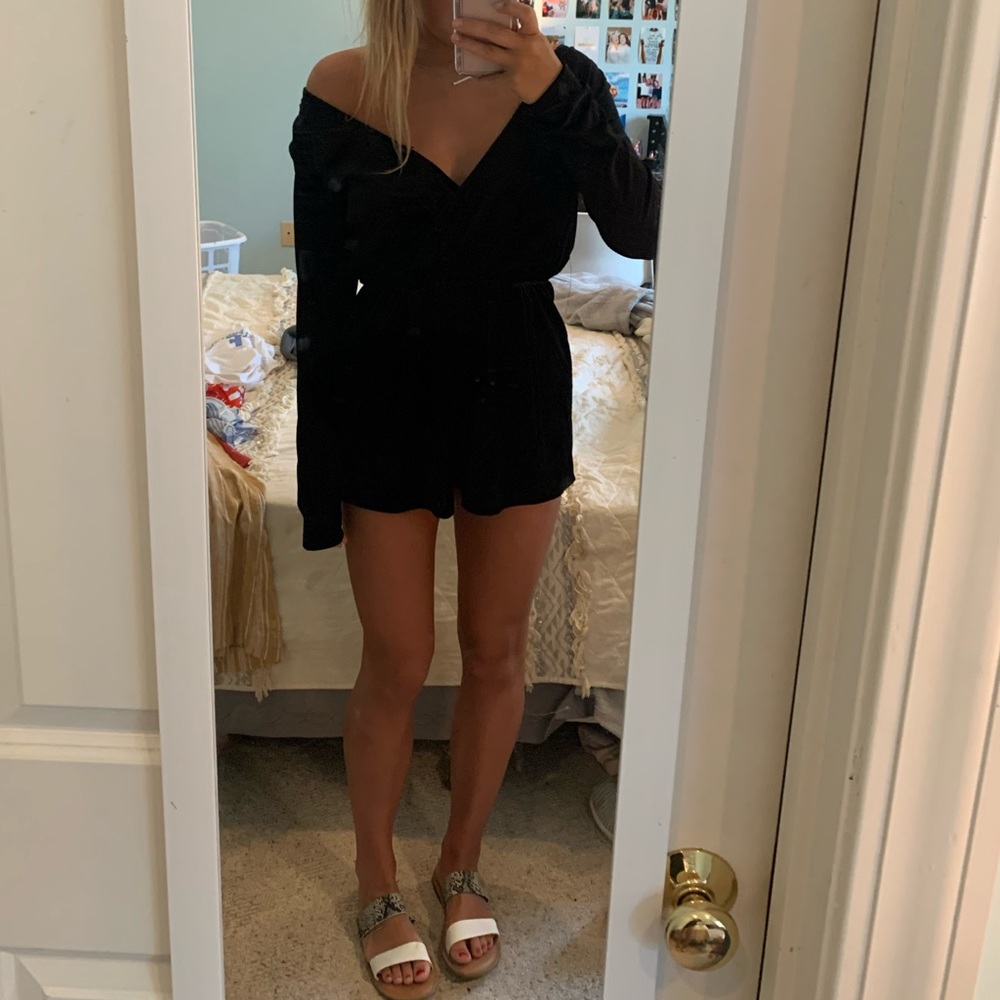 Black, long sleeved dressy romper.